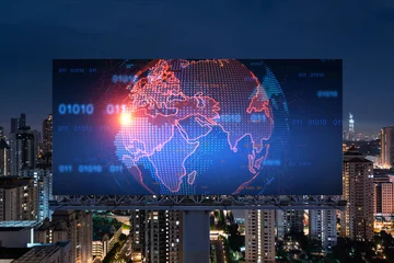 Fotobehang Hologram of Earth planet map on billboard over night panoramic cityscape of Kuala Lumpur, Malaysia, Asia. The concept of international companies in KL. Globe © VideoFlow