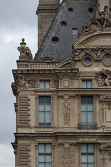Fototapeta na wymiar Detail of the facade of the Louvre in Paris