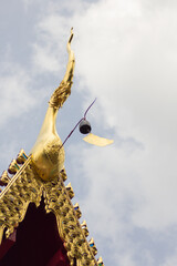 thai golden wood naga gable apex with sky