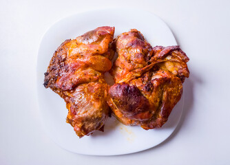 Beautiful juicy barbecue pork meat on a white plate