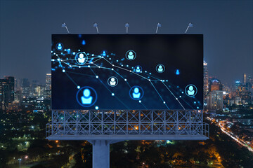 Glowing Social media icons on billboard over night panoramic city view of Bangkok. The concept of networking and establishing new connections between people and businesses in Southeast Asia
