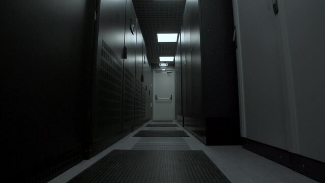 Symmetrically telecommunication racks in a sealed corridor. IT industry, technology concept.
