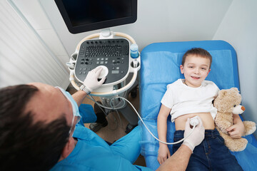 Child getting abdominal preventive check up with an ultrasound