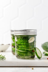 Conservation. Pickled cucumbers. Slices of Marinated cucumbers in glass jars. Homemade fermented cucumbers