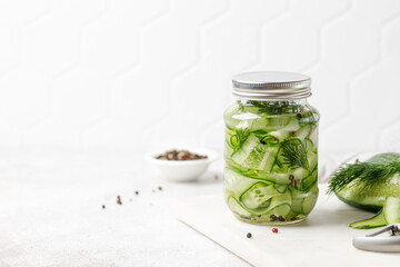 Pickled cucumbers. Slices of Marinated cucumbers in glass jars. Homemade fermented cucumbers. Copy space