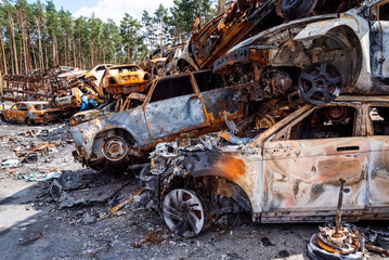 Fototapeta na wymiar IRPIN, Kyiv REGION, UKRAINE 24.04.2022. Car graveyard. Shot cars of civilians. russia's war against Ukraine