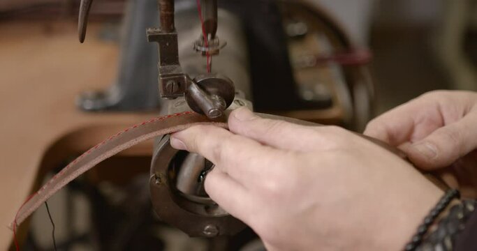 Craftsman working with leather in a workshop