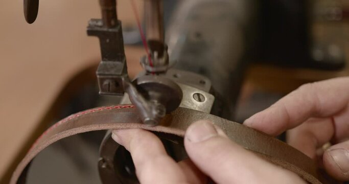 Craftsman working with leather in a workshop
