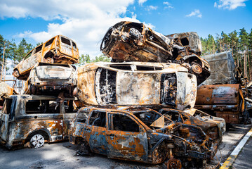 Fototapeta premium IRPIN, Kyiv REGION, UKRAINE 24.04.2022. Car graveyard. Shot cars of civilians. russia's war against Ukraine