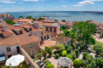 Aerial view of the red roofs of Alfama the historic area of Lisbon on the coast of the Atlantic Ocean. Lisbon is a capital and most famous cities of Portugal