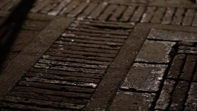Laterite brick stone pattern in landscape design for pathway with evening night light