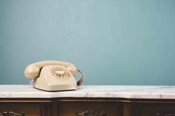 Close-up view of an old telephone on a table.