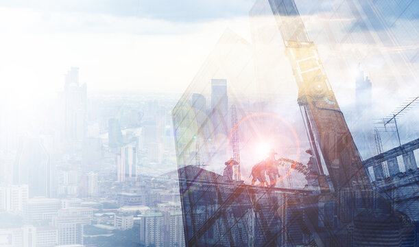 Double exposure architecture engineering teamwork concept, working as team construction worker working frame of building constructing, with skyline building city landscape blue background sunset.