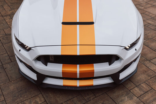 Slovenia, Ljubljana - March 24 2022: White Ford Mustang Shelby GT350 with orange stripes