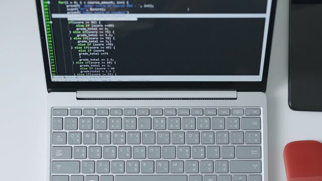 Timelapse of developer programmer hands working on computer laptop, typing keyboard, to check coding in bugging system. Top view