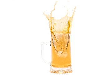 Close up of splashing mug of beer
