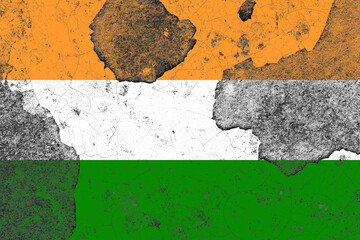 India flag on a damaged old concrete wall surface