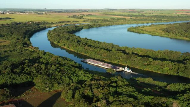 grain barge going up the tiete-parana waterway, on the tiete river