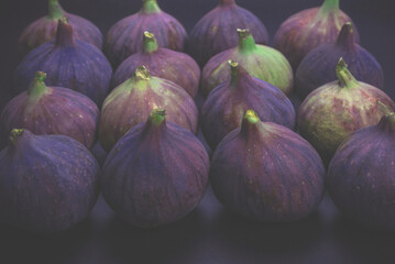 Tasty figs on a black background. Top view.