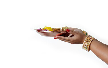 Pooja Thali woman hand holding decorated thali Decorated Pooja Thali for festival