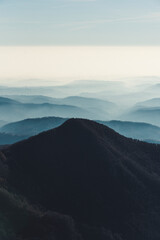 Fototapeta na wymiar Foggy hills landscape in Italy