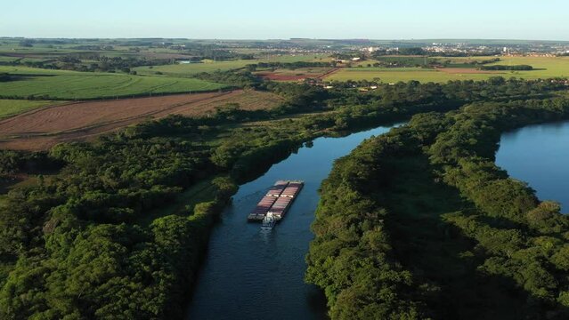 grain barge going up the tiete-parana waterway, on the tiete river