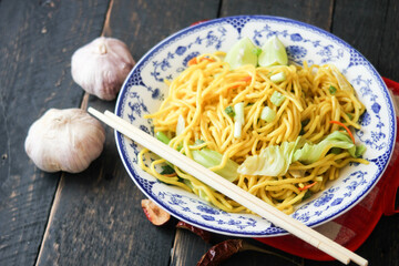 Yakisoba Japanese food In an Asian-style patterned bowl.
