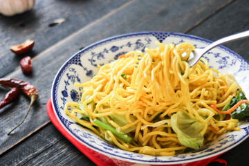 Yakisoba Japanese food In an Asian-style patterned bowl.