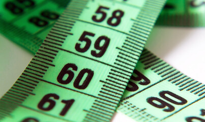 Concept of perfect size of body, health food and diet. Measuring tape with number 90-60-90
