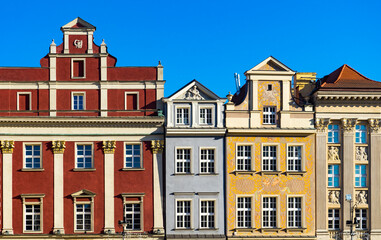 Fototapeta na wymiar colorful houses in Europe. Old buildings of stone houses decorated in multicolored colors. Color buildings in Poznan, Poland