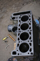 An auto mechanic is working on a car engine in a mechanics garage. Repair service. authentic close-up shot. VAZ 2106