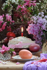 Easter still life with Easter cakes and bouquets of lilacs