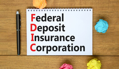 FDIC federal deposit insurance corporation symbol. Concept words FDIC federal deposit insurance corporation on note on white background. Business FDIC federal deposit insurance corporation concept.