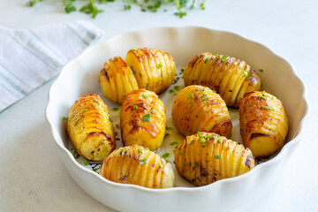 Hasselback potatoes with additional herbs and spices. In Turkey, fan potatoes are known as baked sliced potatoes. (Turkish name; firinda patates, yelpaze patates)