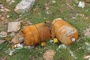 Two butane cylinders burned and abandoned along with other waste in a rural area of ​​the...