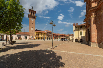 Fototapeta na wymiar Villafalletto, Cuneo, Italy - April 15, 2022: piazza Giuseppe Mazzini, the central square of Villafalletto with the civic tower