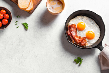 Fried eggs and bacon for breakfast