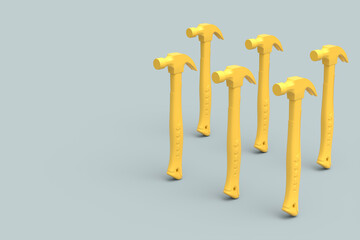 Set of yellow hammers with a rubberized handle on grey background