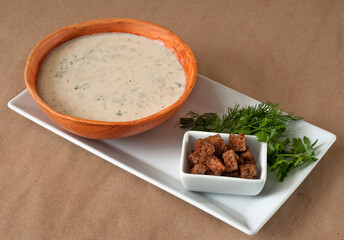 Сreamy soup with spices and crackers.