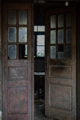Naklejka na ściany i meble Croatia, April 20,2022: Old wooden rustic doors on rural home wall.