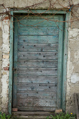 Croatia, April 20,2022: Old wooden rustic doors on rural home wall.