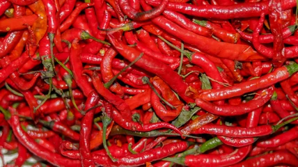 Fotobehang Red chili peppers close up - red chili in the supermarket © arbi wiratama
