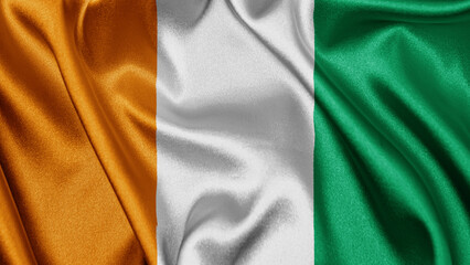 Close up realistic texture fabric textile silk satin flag of Cote d'Ivoire Ivory Coast waving fluttering background. National symbol of the country. 7th of August, Happy Day concept