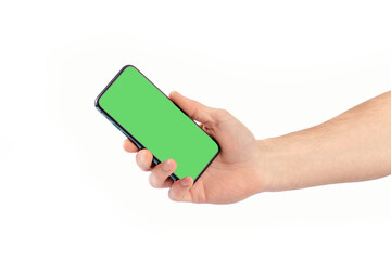 Male hand holding smartphone with green screen, isolate.