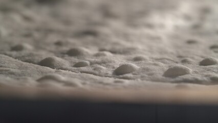 Close-up baking puff pastry cake for the classic Napoleon cake. Dessert in a home oven, macro video of how the puff pastry rises. 4K.