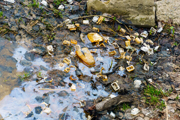 Plastic trash from a lakeside fast food cafe