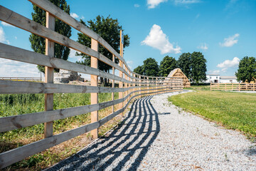 Beautiful day on the farm. Countryside landscape, rural farm and wooden fence