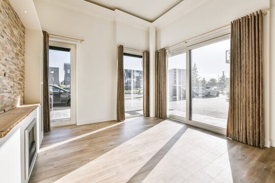 Living room with fireplace in flat with laminate floor
