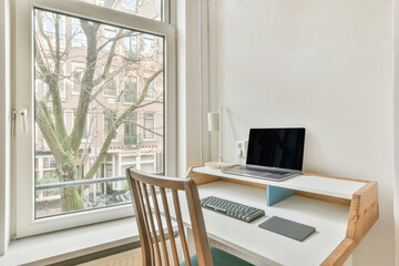 Modern workplace with desk and chair with laptop