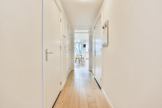 Long corridor with white walls